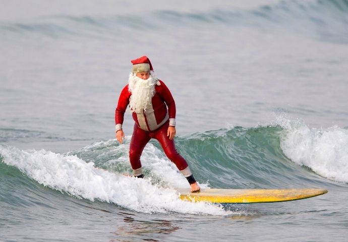 Christmas Eve Traditions in Australia Surfing Santa