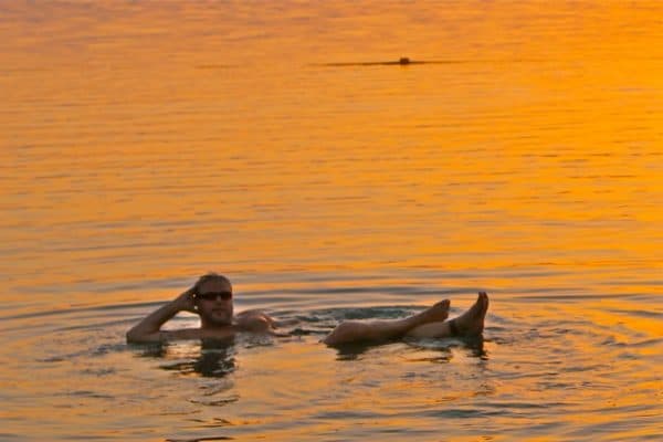 Floating in the Dead Sea at Sunset