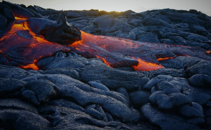 Hot lava flows at Hawaii Volcanoes National Park show the unique geological processes that led to the park becoming a UNESCO natural site